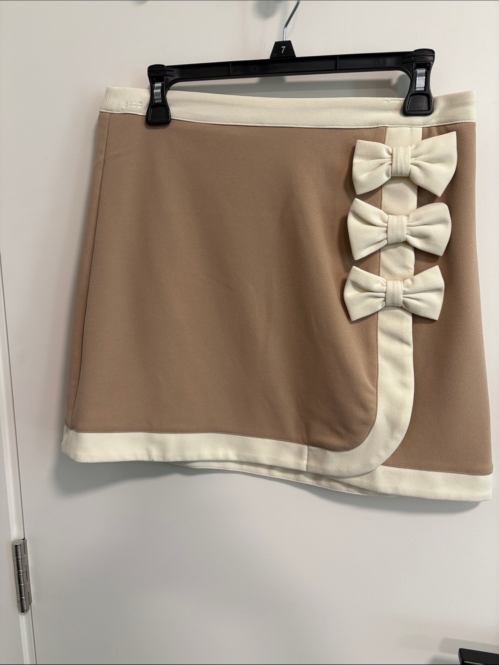 Umgee Taupe Mini Skirt with Cream Bow Accents